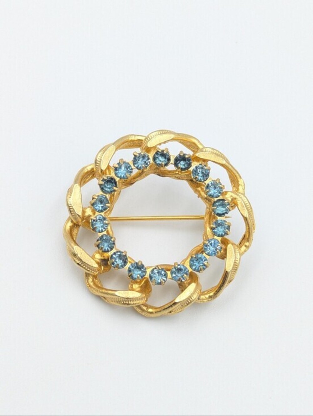 Vintage mid-century gold tone and ice blue rhinestone circle brooch pin